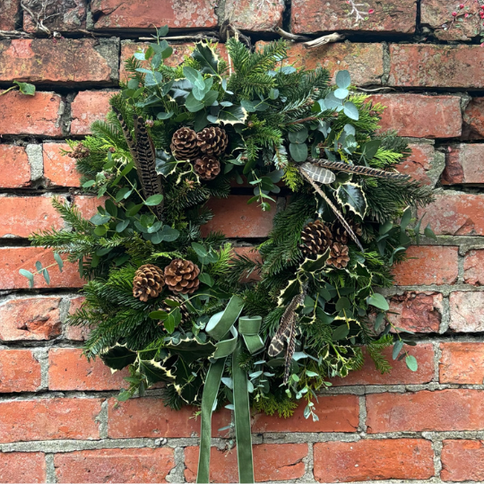 Eucalyptus Wreath with pine cones, pheasant feathers and a natural look and feel. Available for delivery in Darlington and Nationwide
